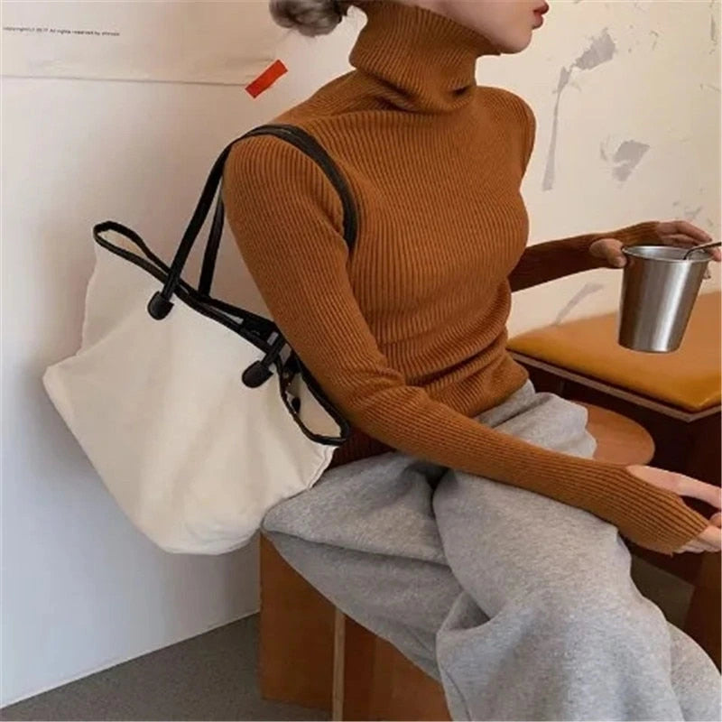 Woman wearing brown ribbed turtleneck slim fit jumper