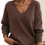 Woman wearing dark brown deep V-neck cashmere-feel knit jumper