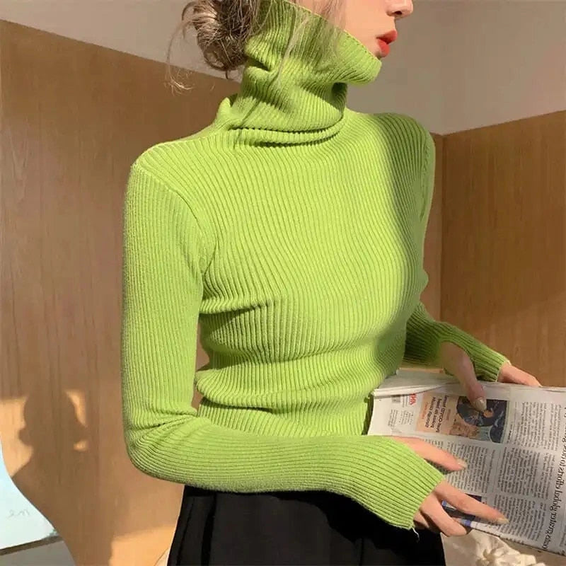 Woman wearing light green ribbed turtleneck slim fit jumper