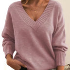 Woman wearing pink deep V-neck cashmere-feel knit jumper