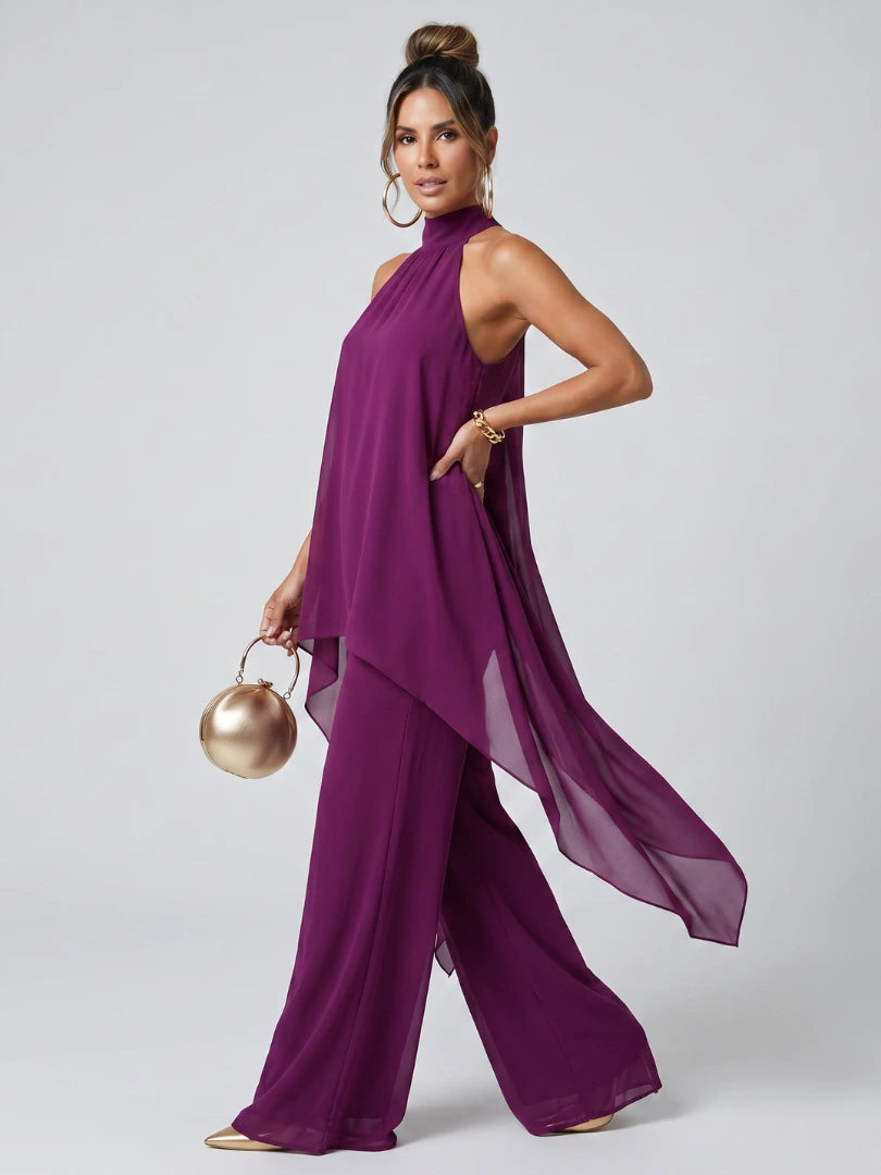 Woman wearing a purple asymmetric tunic wide-leg set - studio photo