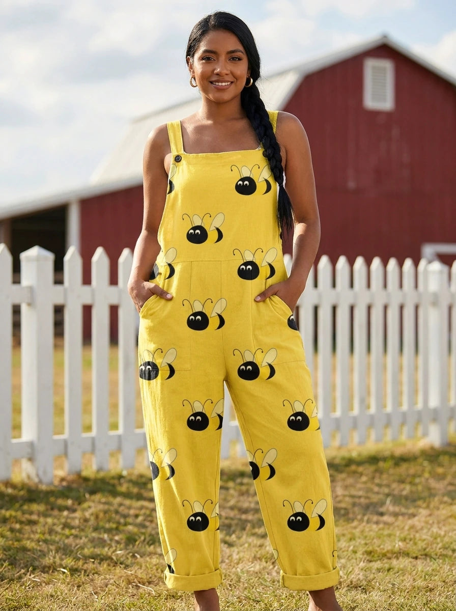 Woman wearing a yellow jumpsuit with a black bumblebee print on a farm