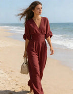 Woman wearing a sky blue elegant wide-leg jumpsuit - lifestyle photo