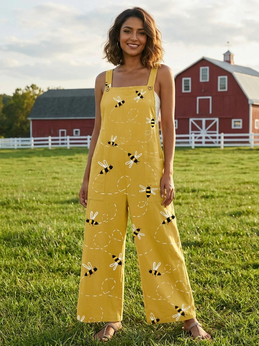 Woman wearing a honeybee floral print jumpsuit in a farm setting