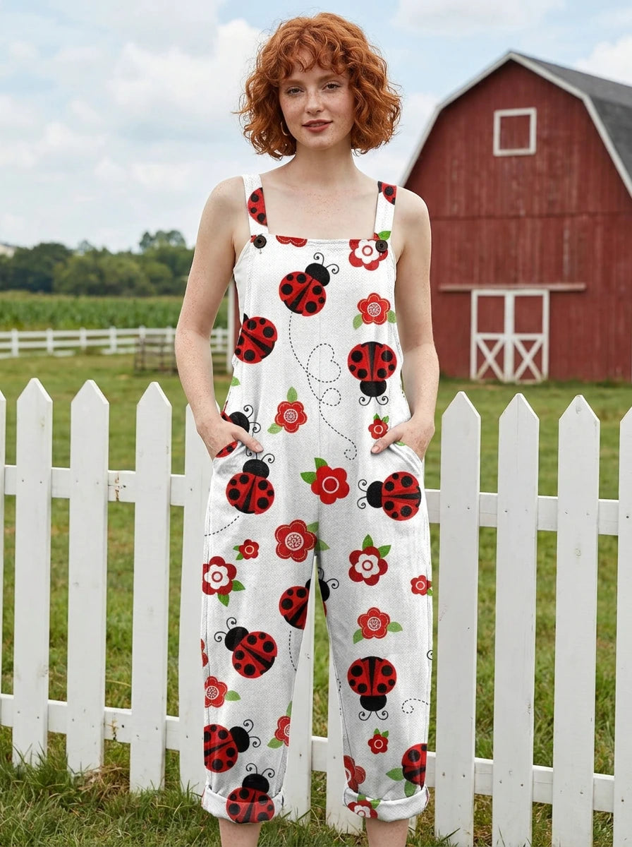 Woman wearing a white jumpsuit with a red ladybug and floral print on a farm