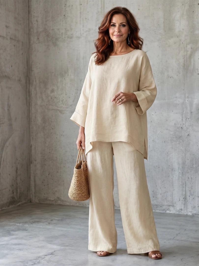Woman wearing a beige oversized tunic wide-leg set - studio photo