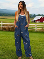 Woman wearing a printed tie-waist jumpsuit in a farm setting