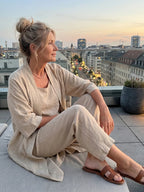 Woman wearing a beige relaxed three-piece set - editorial style photo