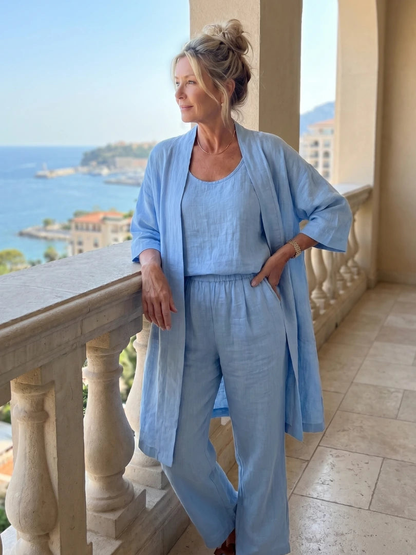 Woman wearing a blue relaxed three piece set jumpsuit - editorial style photo