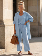 Woman wearing a blue relaxed three-piece set - editorial style photo