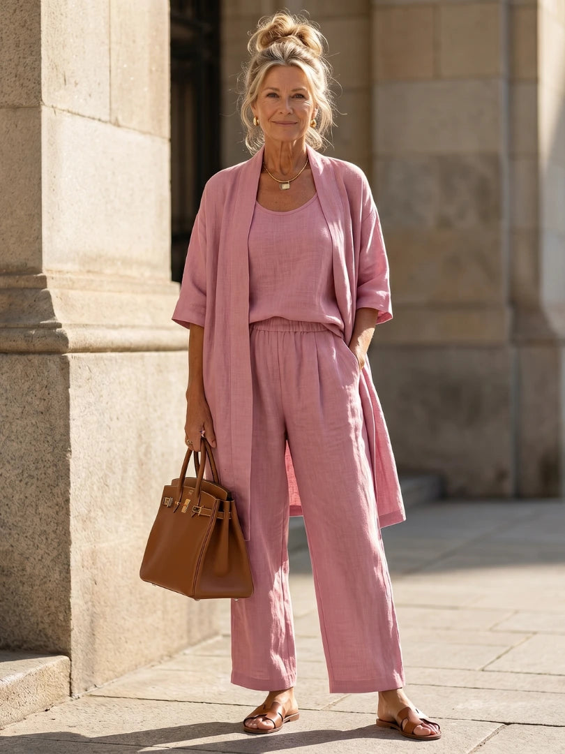Woman wearing a pink relaxed three-piece set - studio photo