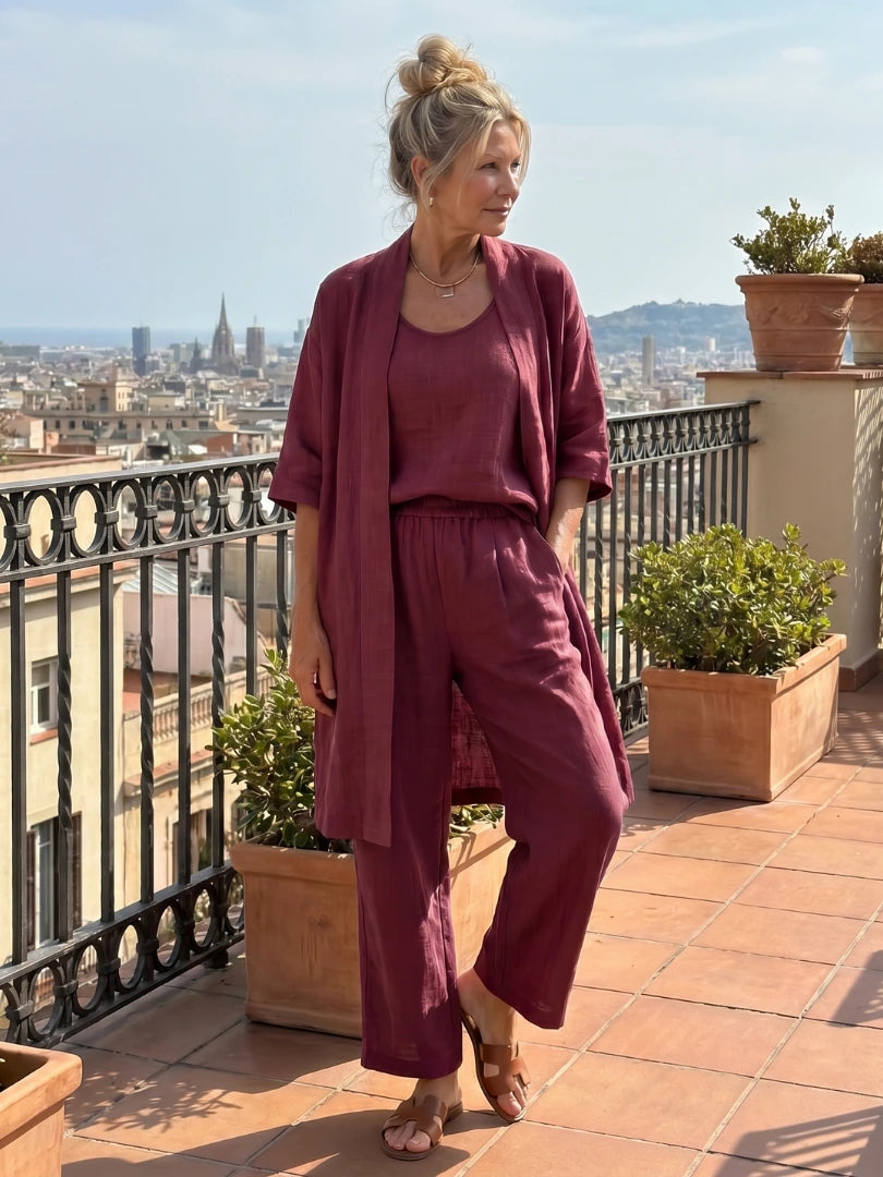 Woman wearing a red relaxed three piece set jumpsuit - editorial style photo