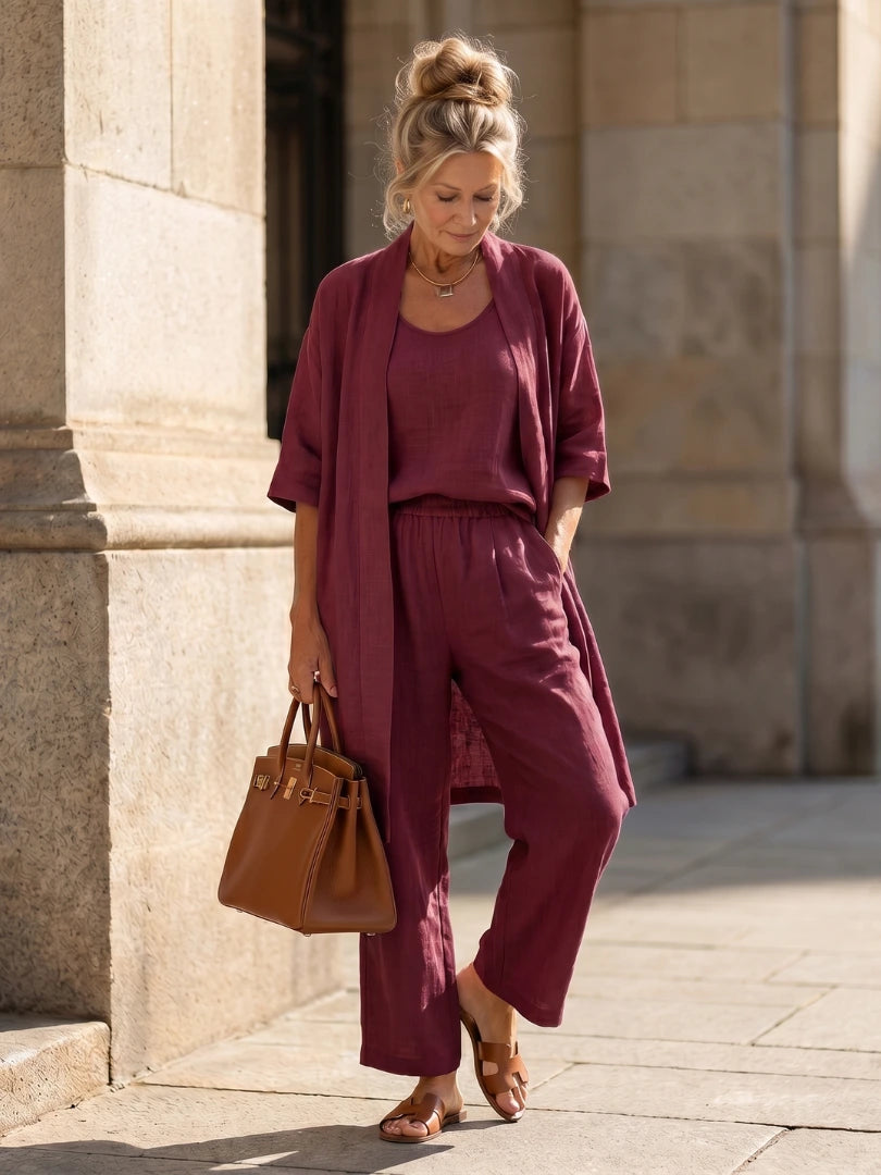Woman wearing a red relaxed three piece set jumpsuit - editorial style photo