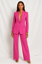 Woman wearing a hot pink stretch crepe two-piece jumpsuit - studio photo
