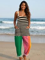 Woman wearing a striped and color-block jumpsuit on the beach