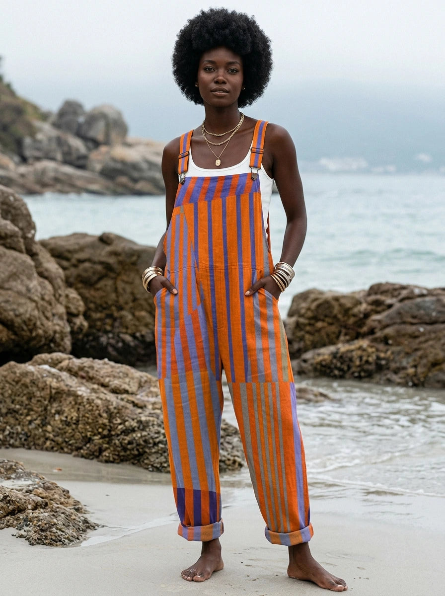 Woman wearing a sunset print jumpsuit on a beach