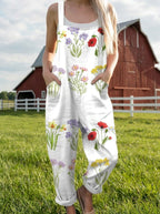Woman wearing a wildflower print jumpsuit in a farm setting