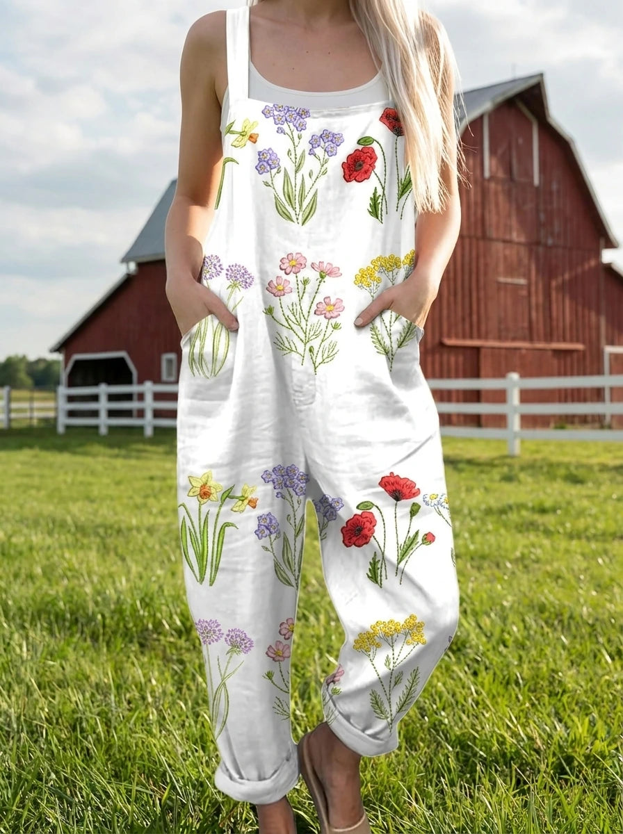 Woman wearing a wildflower print jumpsuit in a farm setting