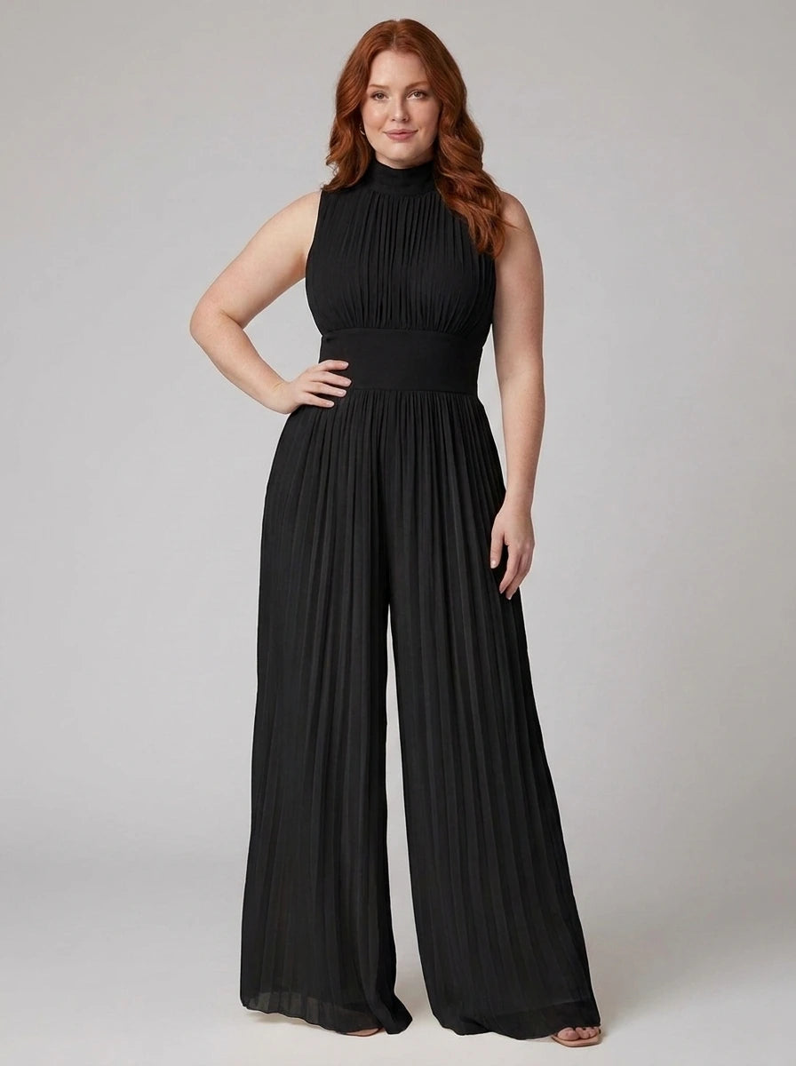 Woman wearing a black pleated sleeveless jumpsuit with structured collar and front zip, studio shot