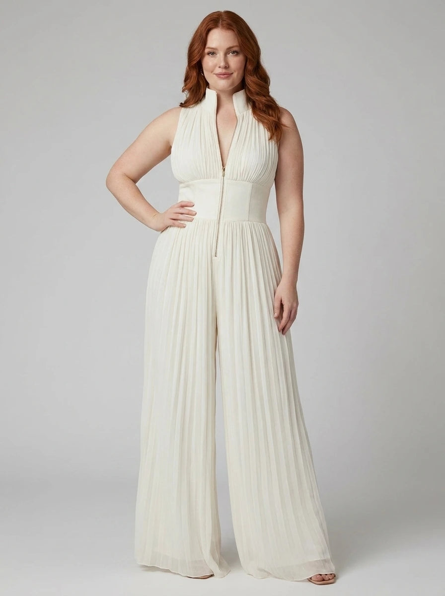 Woman wearing a white pleated sleeveless jumpsuit with structured collar and front zip, studio shot