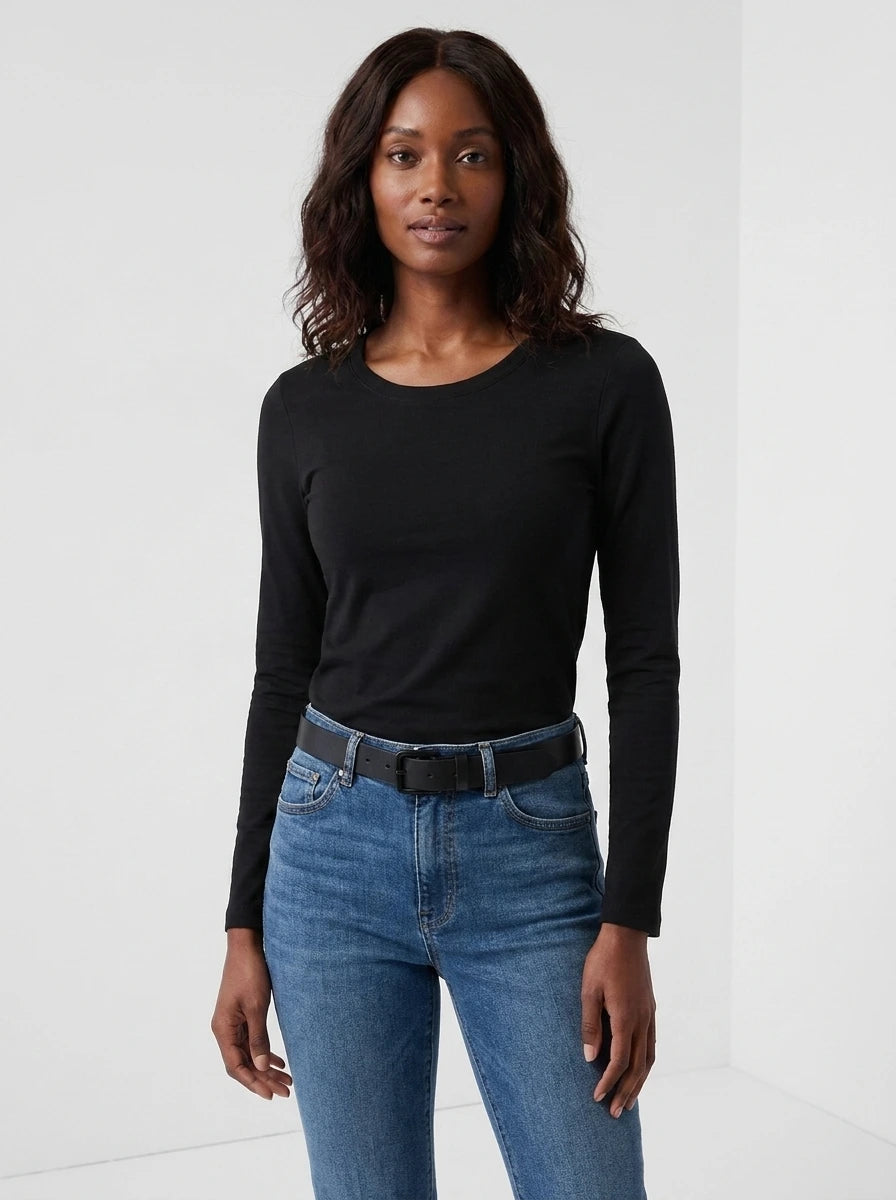Woman wearing a black cotton long sleeve t-shirt, studio front view