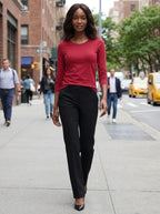 Woman wearing a red cotton long sleeve t-shirt walking on a city street