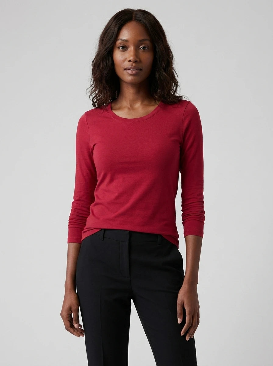 Woman wearing a red cotton long sleeve t-shirt, studio front view