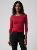 Woman wearing a red cotton long sleeve t-shirt, studio front view