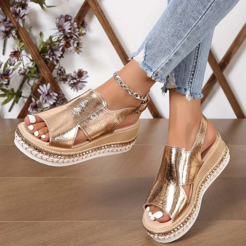 Woman wearing a gold wedge heeled platform orthopedic sandal - lifestyle photo