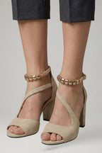 Woman wearing beige block heel adjustable strap sandals - lifestyle photo