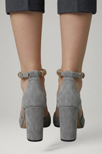 Woman wearing black block heel adjustable strap sandals - lifestyle photo