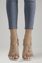 Woman wearing champagne gold block heel cushioned sandals - lifestyle photo