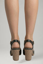 Woman wearing black block heel cushioned open-toe sandals - lifestyle photo