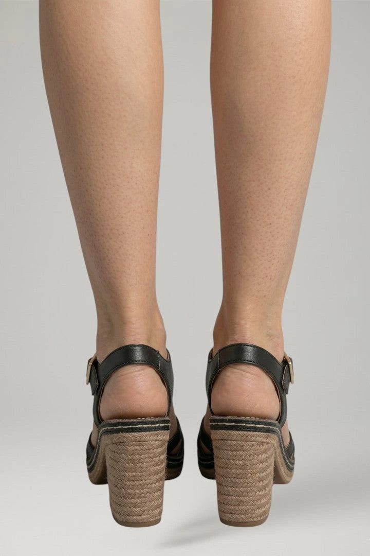 Woman wearing black block heel cushioned open-toe sandals - lifestyle photo