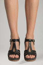 Woman wearing black block heel cushioned open-toe sandals - lifestyle photo