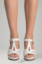 Woman wearing white block heel cushioned open-toe sandals - lifestyle photo