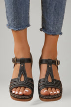 Woman wearing black block heel cushioned strap sandals - lifestyle photo