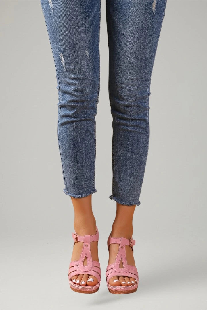 Woman wearing pink block heel cushioned strap sandals - lifestyle photo