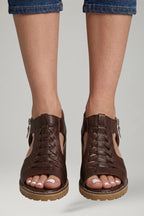 Woman wearing red block heel zip closure sandals - lifestyle photo
