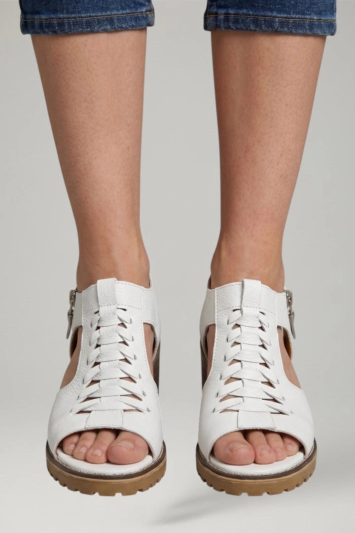 Woman wearing white block heel zip closure sandals - lifestyle photo