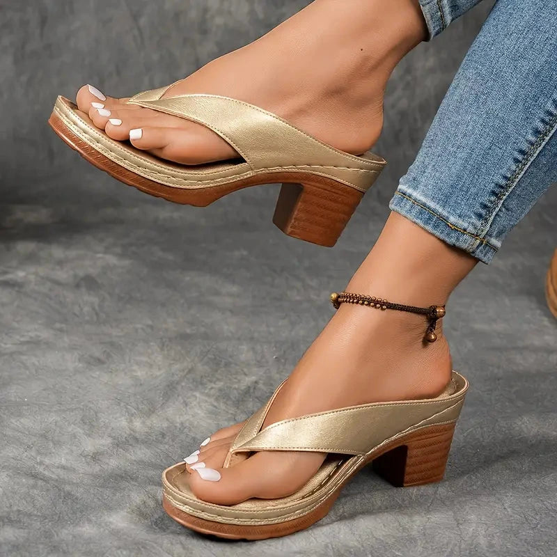 Woman wearing a black heeled thong orthopedic sandals - lifestyle photo