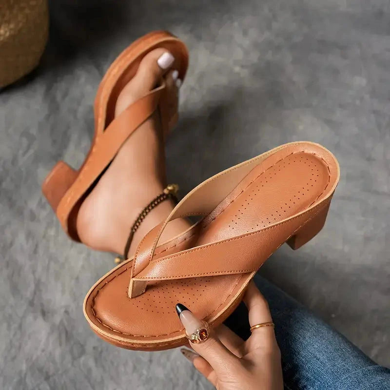 Woman wearing a brown heeled thong orthopedic sandals - lifestyle photo