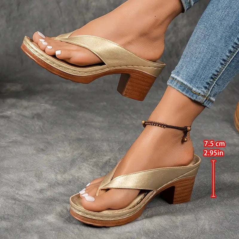 Woman wearing a gold heeled thong orthopedic sandals - lifestyle photo