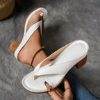 Woman wearing a white heeled thong orthopedic sandals - lifestyle photo