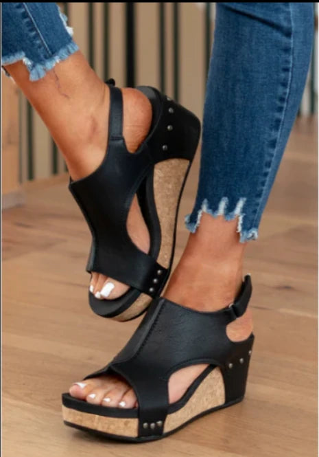 Woman wearing black wedge slingback sandals - lifestyle photo