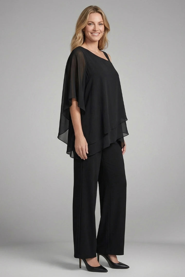 Woman wearing a black asymmetrical top wide leg set - studio photo
