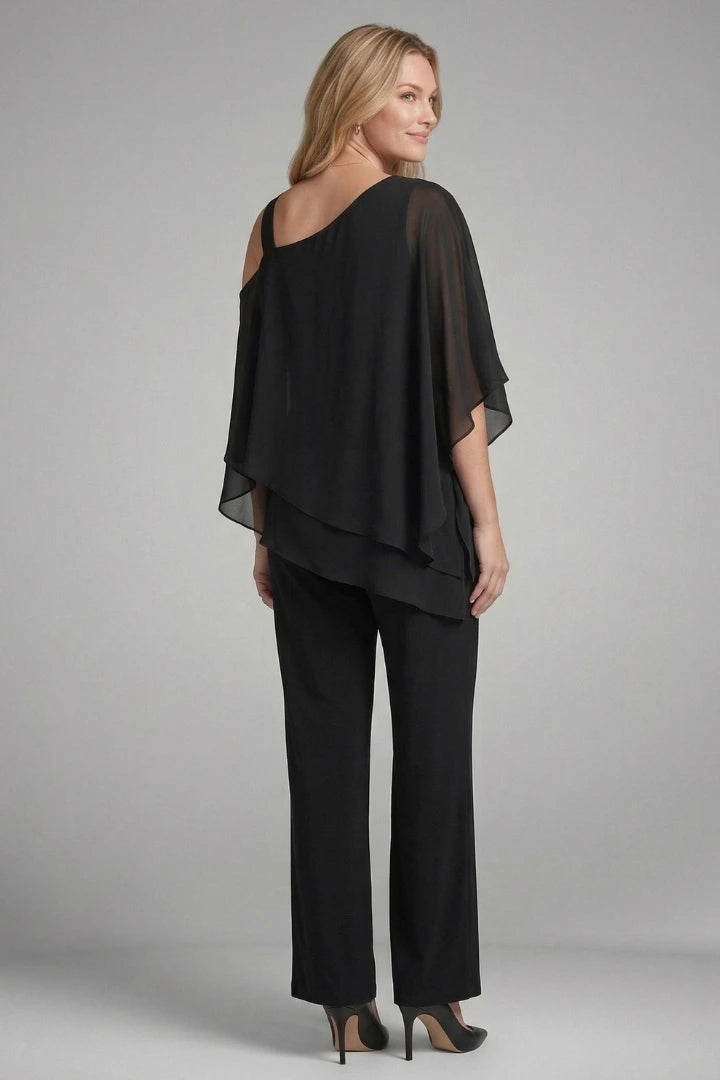 Woman wearing a black asymmetrical top wide leg set - studio photo