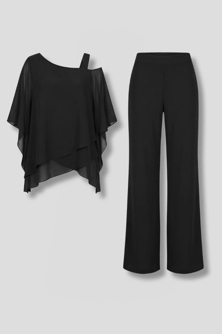 Woman wearing a black asymmetrical top wide leg set - studio photo