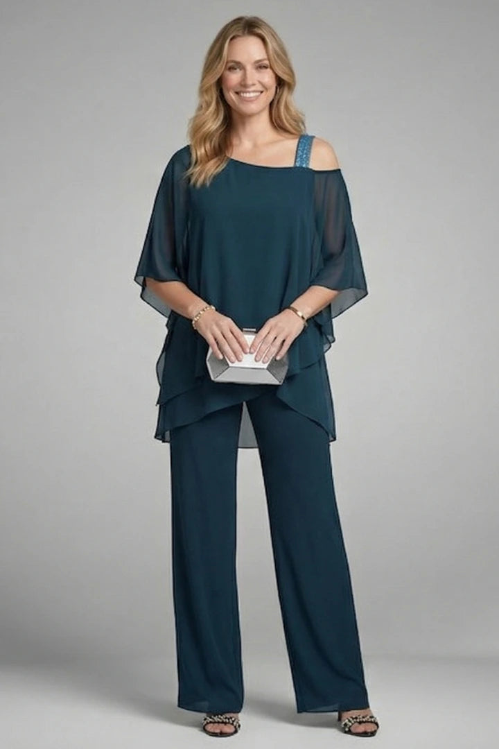 Woman wearing a navy blue asymmetrical top wide leg set - studio photo