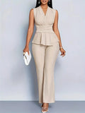 Woman wearing a beige sleeveless top trousers set - studio photo